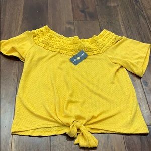 Mustard shirt with knot on bottom